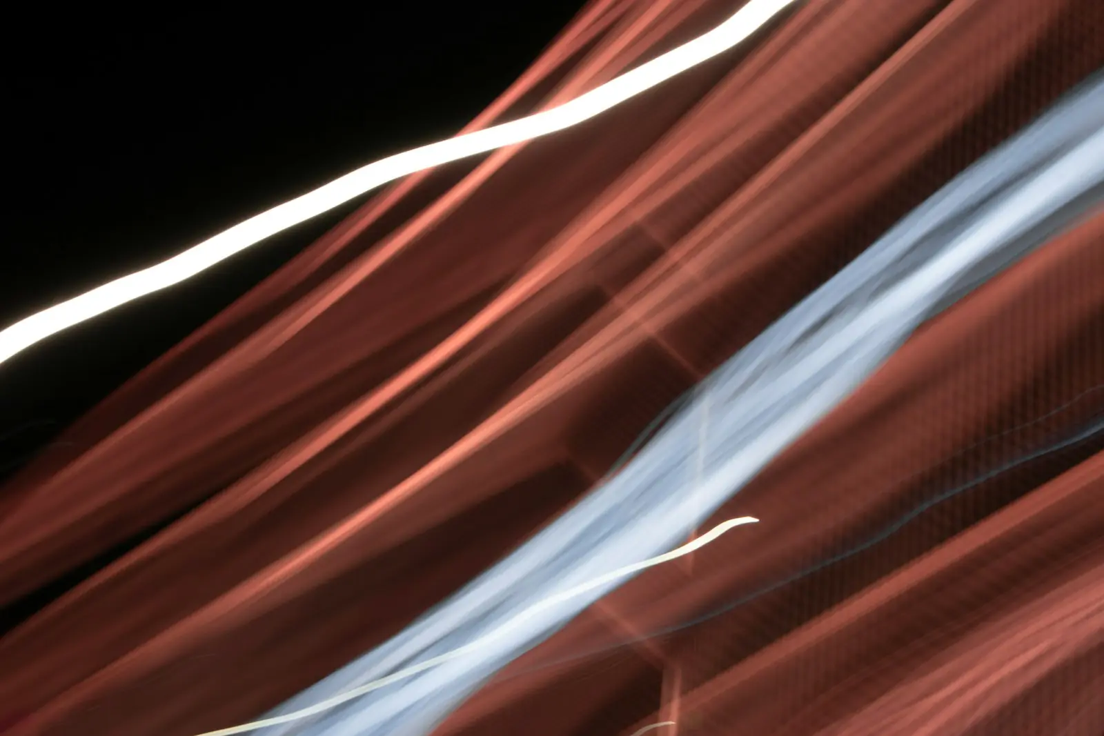 Abstract streaks of light against dark background